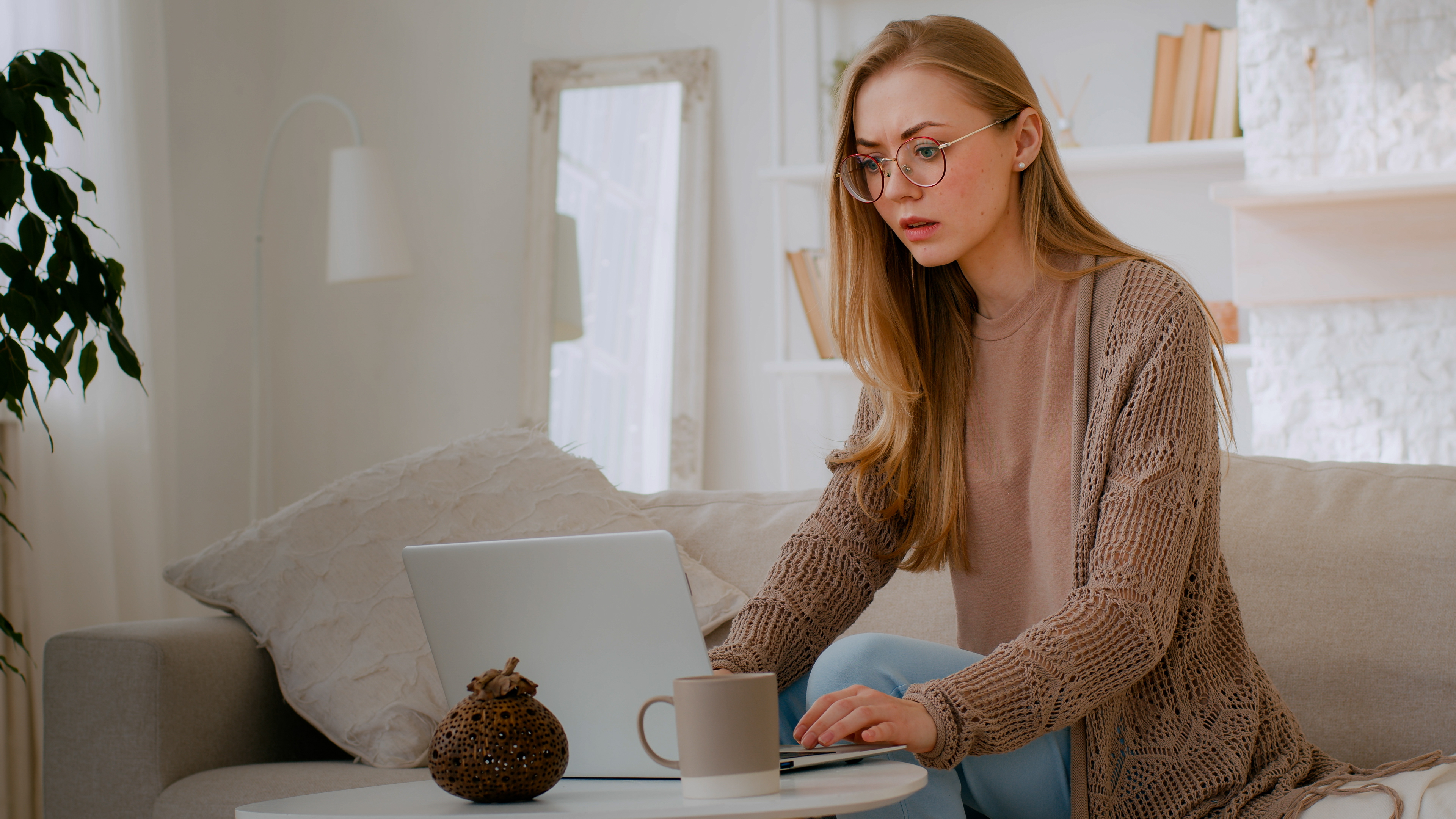 Caucasian shocked girl in glasses feel shock reading bad news woman lost with laptop worry about